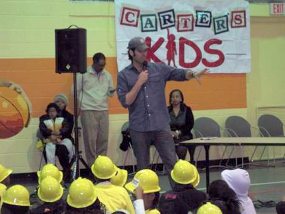 Carter Oosterhouse addresses some of the children in his Carter’s Kids at an event.