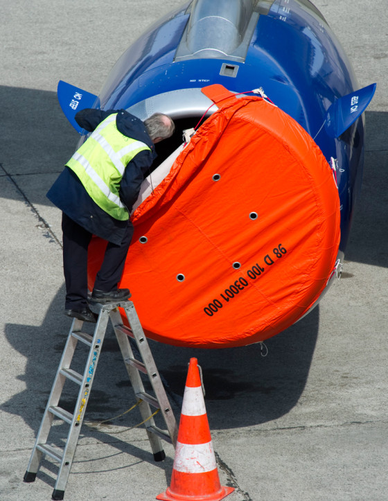 Image: A technician inspects a engine of a British Airways aircraft in Berlin