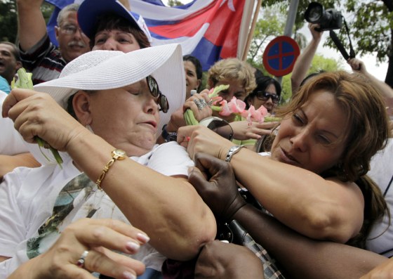 Image: Members of the Ladies in White struggle with pro-government supporters in Havana