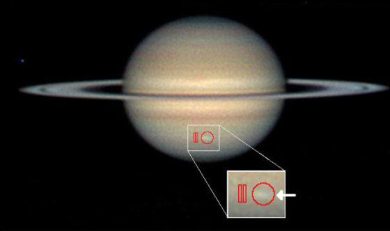 Amateur astronomer Christopher Go took this image of the storm on March 13, 2010. The arrow indicates the location of the storm and the red outlines show where Cassini's composite infrared spectrometer gathered data.