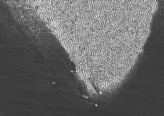 This satellite image shows vessels at the source of the leaking oil, at the same location where just a week before the platform Deepwater Horizon sank after burning for two days.