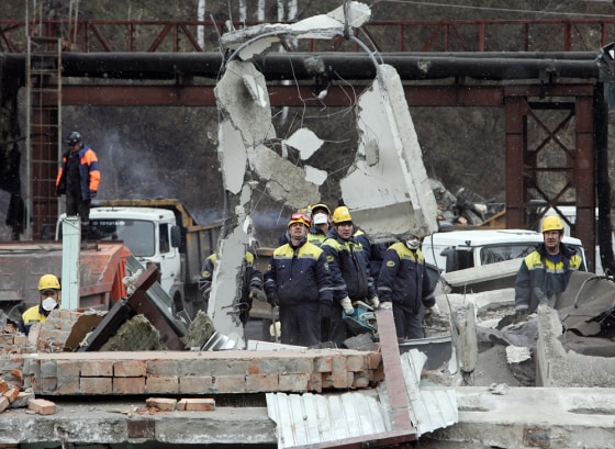 Image: Debris at the site of an underground explosion at a mine in Siberia