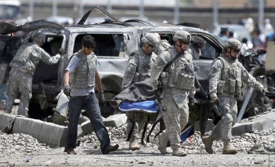 Image: U.S. soldiers at the site of a suicide car bomb in Kabul