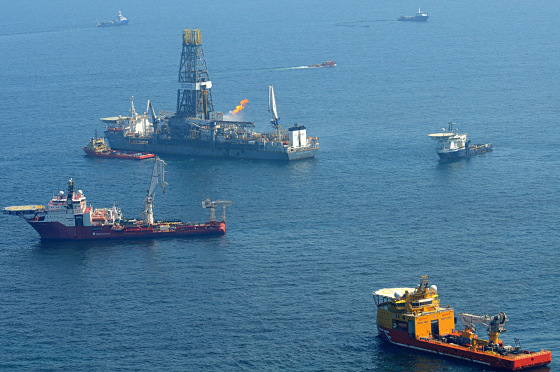 Image: Offshore supply vessels assist and observe the worksite of the Deepwater Horizon oil rig