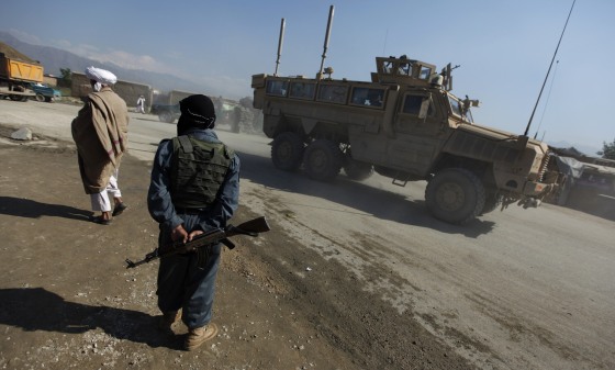 Image: A U.S. military vehicle enters the road leading to the U.S. airbase in Bagram