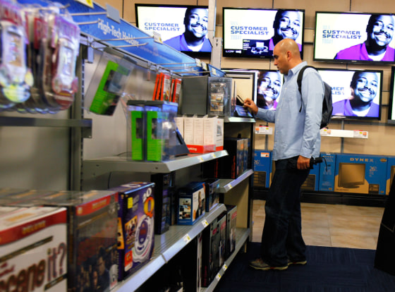 Image: A man shops for electronics at a Best Buy store in New York