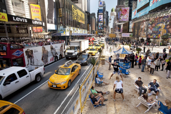 Image: People play volleyball and lounge on Military Island in the middle of Times Square