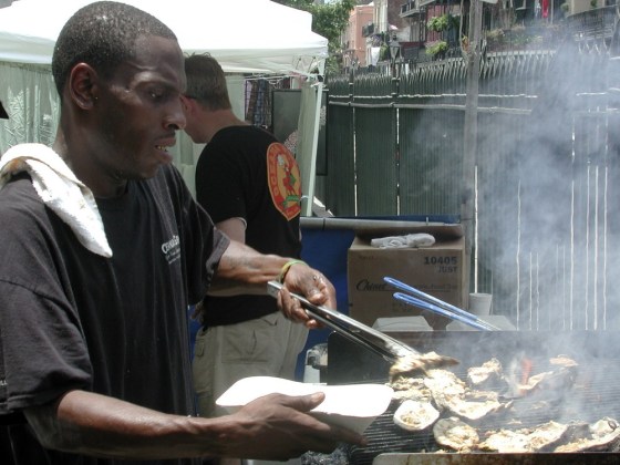Image: DeShawn Harris of Oceana Restaurant grills oysters at the Louisiana Seafood Festival in New Orleans.