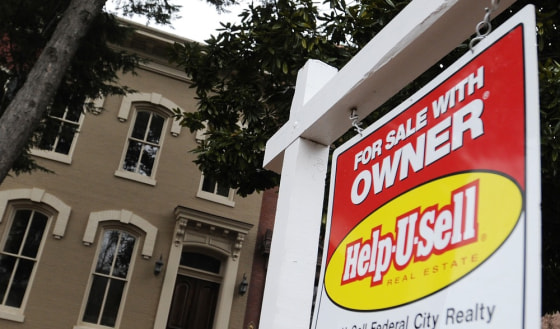 Image: A sign marks a house for sale by the owner in the Capitol Hill neighborhood in Washington