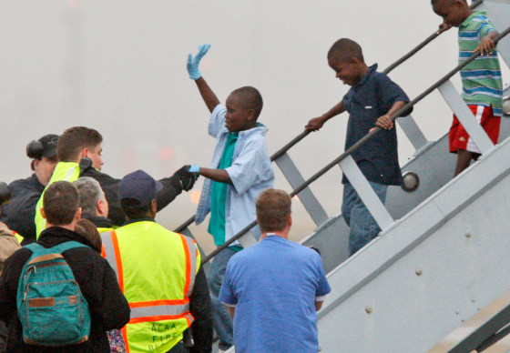 Image: Haitian orphans, whose orphanage was destroyed, arrive at Pittsburgh International Airport on Tuesday, Jan. 19, 2010