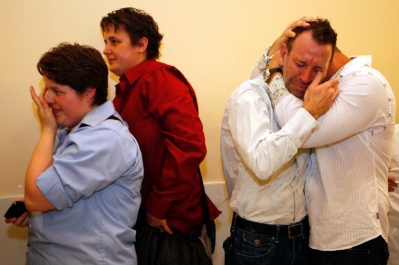 Image: same-sex couples embrace