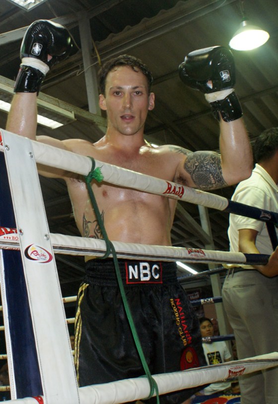 Lee Aldhouse celebrates after winning a Muay Thai fight in Phuket in 2009. The letters on his waistband stand for "Nai Harn Boxing Club."