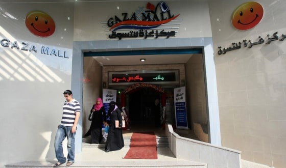 Image: Palestinians leave the newly opened \"Gaza Mall\" in Gaza City