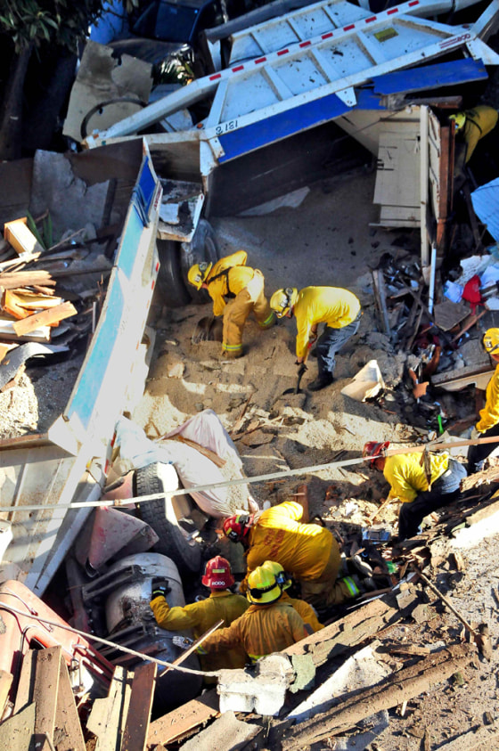 Image: Santa Barbara County fire fighters search the site where a heavily loaded gravel truck lost its brakes and smashed into a home