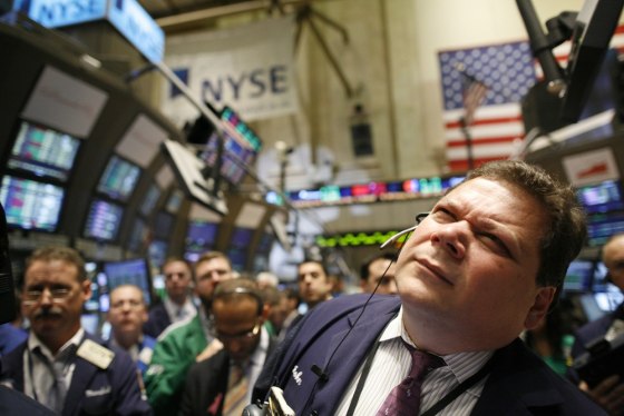 Image: Traders work on the floor of the New York Stock Exchange