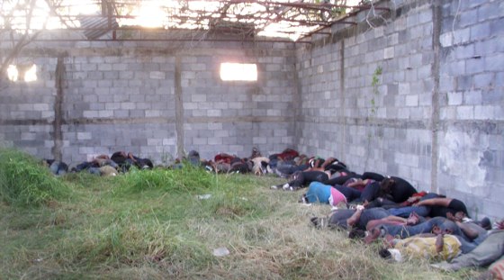 In a photo from Telemundo, the bodies of some of the 72 people killed at a ranch in Mexico are seen shortly after the discovery.