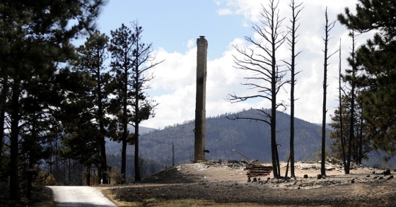 Image: A chimney of a home destroyed by the Fourmile Canyon fire remains standing near Sunshine Canyon in Boulder, Colorado