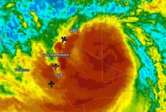 Image: Planes trek through Hurricane Karl