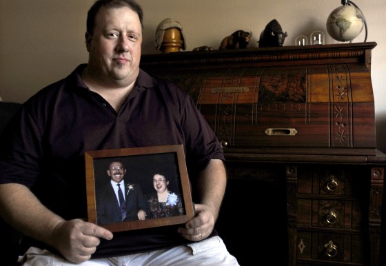 Craig Kurtz holds a framed photo of his father and mother, who were killed in a plane crash six years ago near Raleigh, N.C. The small aircraft Jerome and Carolyn Kurtz were trying to land contained no black box recorder and investigators were unable to determine the cause of the crash. Most small planes are not required to have any kind of data recorders, even though they account for most airplane accidents.