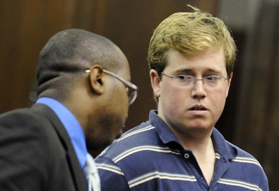 Image: Michael Enright talks with attorney