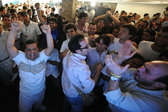 Image: Supporters of opposition candidates for the National Asembly celebrate after learning the results of the polls