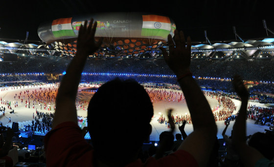 Image: Spectators cheer during the XIX Commonwe