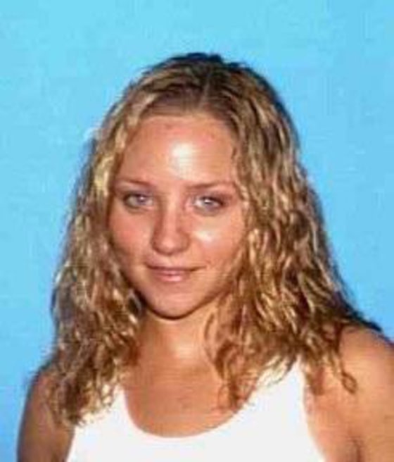 Monica McCarrick, pictured in a photograph released by Fairfield Police, is accused of stabbing her twin daughters, age 3, to death.