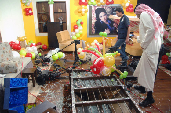 Image: A demolished TV studio is seen after an angry crowd stormed a Kuwaiti private television station