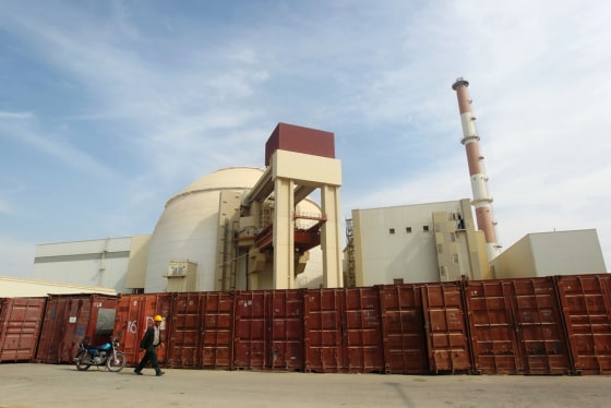 Image: Russian worker walks past Bushehr nuclear power plant, 1,200 km south of Tehran