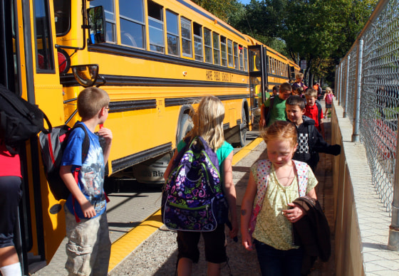 Students leave buses at Lincoln-McKinley Primary School in Havre, Mont., where classes are held year-round.