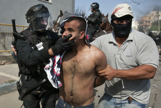Image: Israeli border and undercover police arrest an Arab-Israeli protestor in Umm Al-Fahm