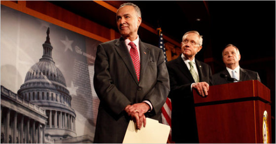 Democratic Senators Charles E. Schumer of New York and Richard J. Durbin of Illinois flank the majority leader, Harry Reid of Nevada