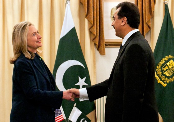 Image: Pakistan's PM Gilan greets U.S. Secretary of State Clinton at the prime minister's residence in Islamabad