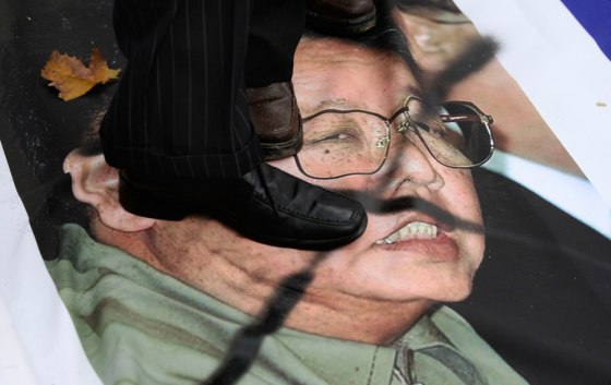 Image: Protesters trample a portrait of North Korea leader Kim Jong Il in front of the Defense Ministry in Seoul