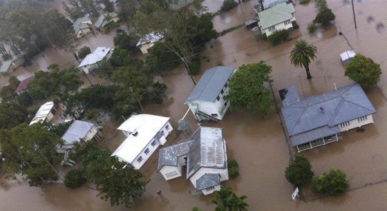 Image: Houses in the town of Theodore are partially submerged by flood waters