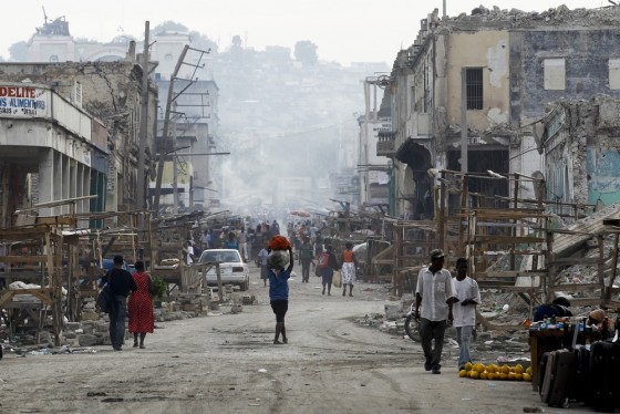 Image: People walk on a street in downtown Port-au-Prince