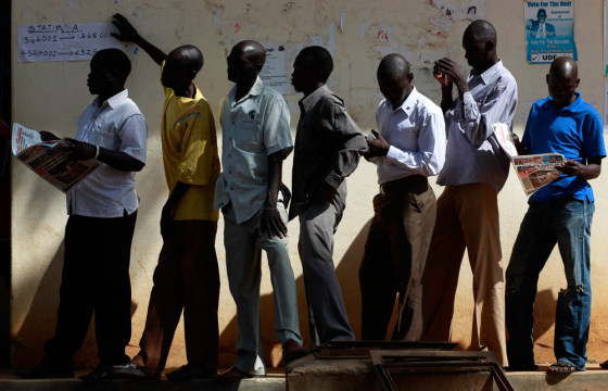 Image: South Sudanese men wait to casts their vote at a polling station in Juba, Southern Sudan, Monday