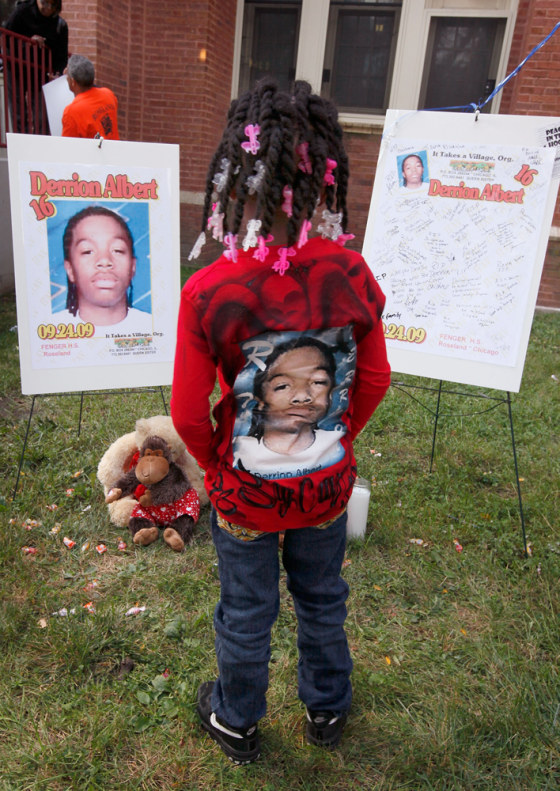 Image: Nadashia Thomas looks over a memorial outside Fenger High School for 16-year-old Fenger honor roll student Derrion Albert