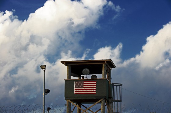Image:a member of the US military mans one of the guard posts at sunrise at Camp Delta, part of the US Detention Center in Guantanamo Bay