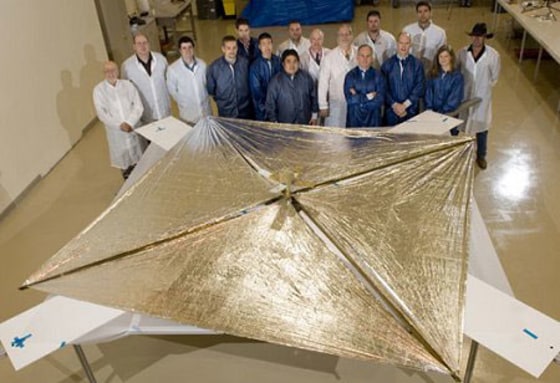 The Huntsville-based NanoSail-D team stands with the fully deployed sail at ManTech SRS technologies on April 16, 2008, after a successful deployment test.