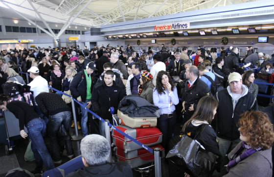Image: Air travelers wait in line