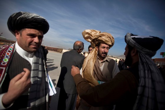 Image: Members of the Afghan parliament congratulate each other after an inauguration ceremony in Kabul