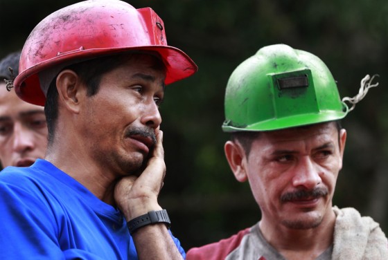 Image: Miner Fabio Veloza weeps in front of the La Preciosa