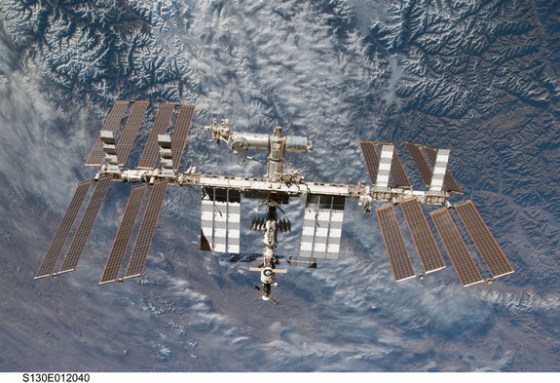 With the Earth's rugged terrain in the background below it, the International Space Station is photographed by an STS-130 crew member on space shuttle Endeavour after the station and shuttle began their post-undocking separation.