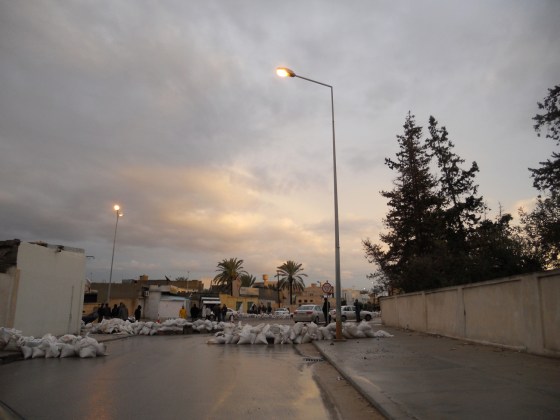 A common street scene in Misurata, with sandbag barricades and armed local residents standing guard
