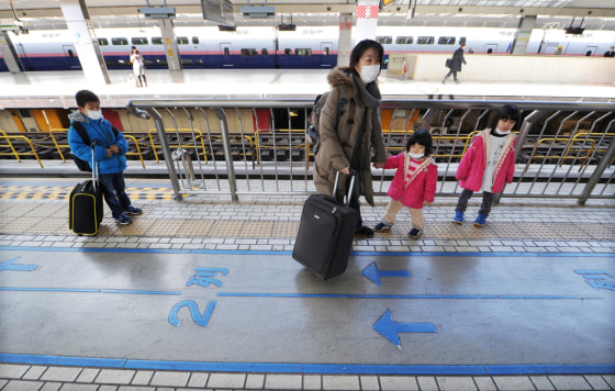 Image: Women and Children Leave Tokyo Over Radiation Concerns
