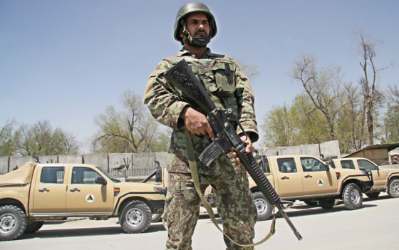 Image: Afghan soldiers secure the Defense Ministry after a suicide bomb attack, in Kabul