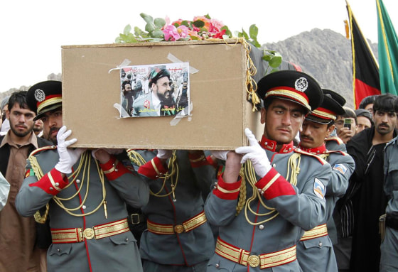 Image: Afghan National Police honor guards carry a coffin of slain police chief of Afghanistan's southern Kandahar province
