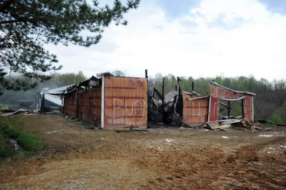 Image: The remains of Brent Whitehouse's barn in McConnelsville smolder