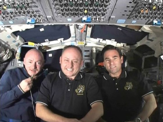 Image: Commander Mark Kelly is joined by astronauts Michael Fincke and Greg Chamitoff from the aft flight deck of the Endeavour